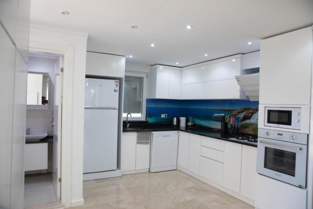 A kitchen or kitchenette at Sunrise hill villa with private pool