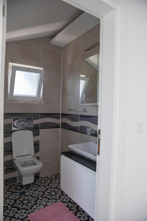 A bathroom at Sunrise hill villa with private pool