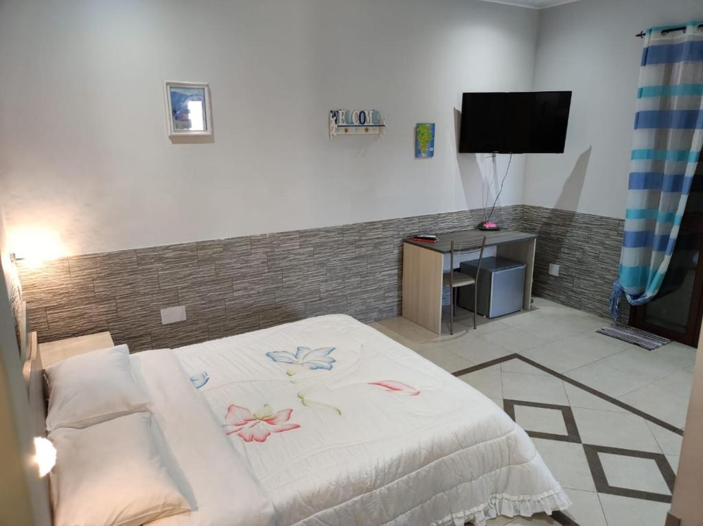 TV a/nebo společenská místnost v ubytování B&B AMURI RANNI