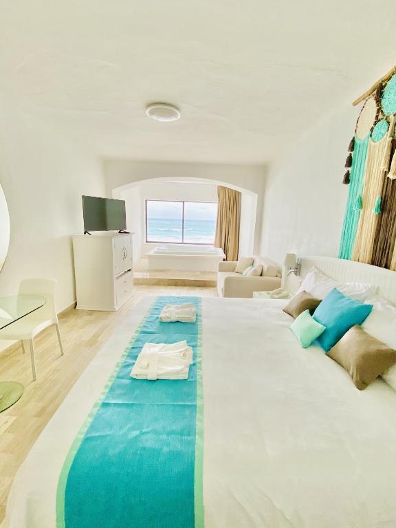 Postel nebo postele na pokoji v ubytování Cyan Cancun Resort & Spa
