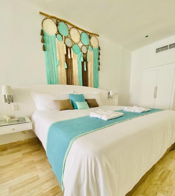 Postel nebo postele na pokoji v ubytování Cyan Cancun Resort & Spa