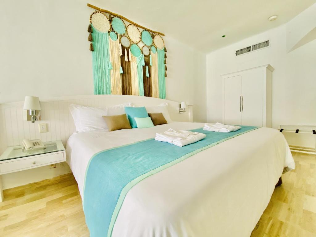 Postel nebo postele na pokoji v ubytování Cyan Cancun Resort & Spa