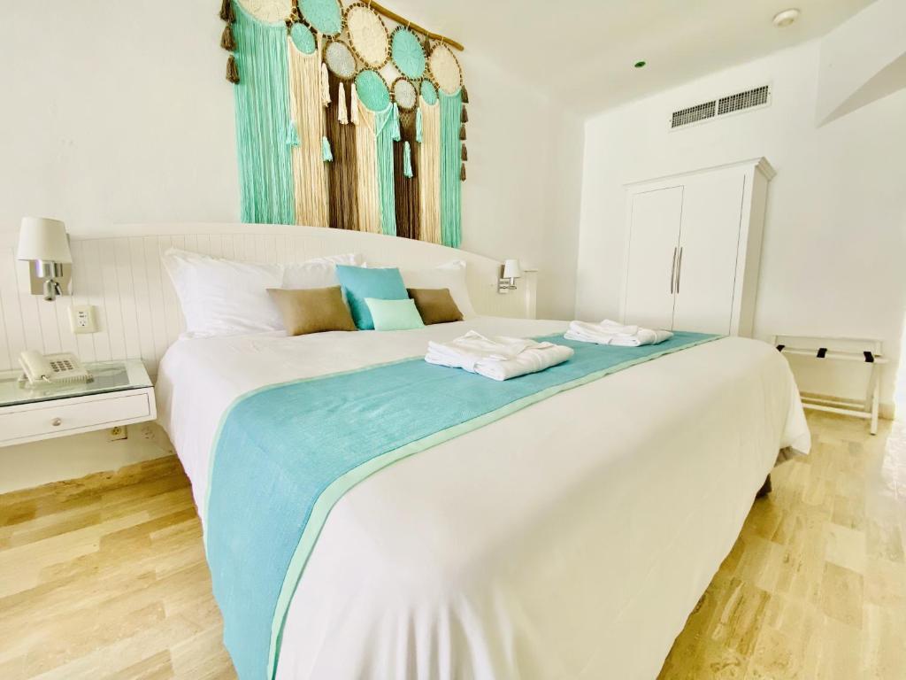 Postel nebo postele na pokoji v ubytování Cyan Cancun Resort & Spa