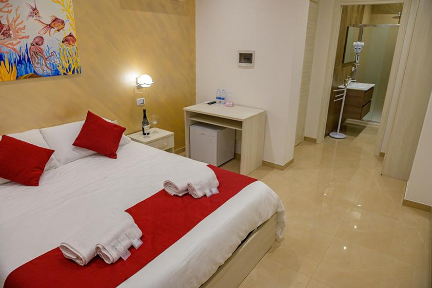 Posteľ alebo postele v izbe v ubytovaní Corallo Rosso B&B