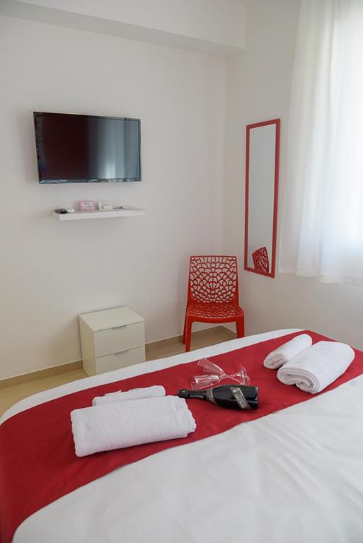 Posteľ alebo postele v izbe v ubytovaní Corallo Rosso B&B