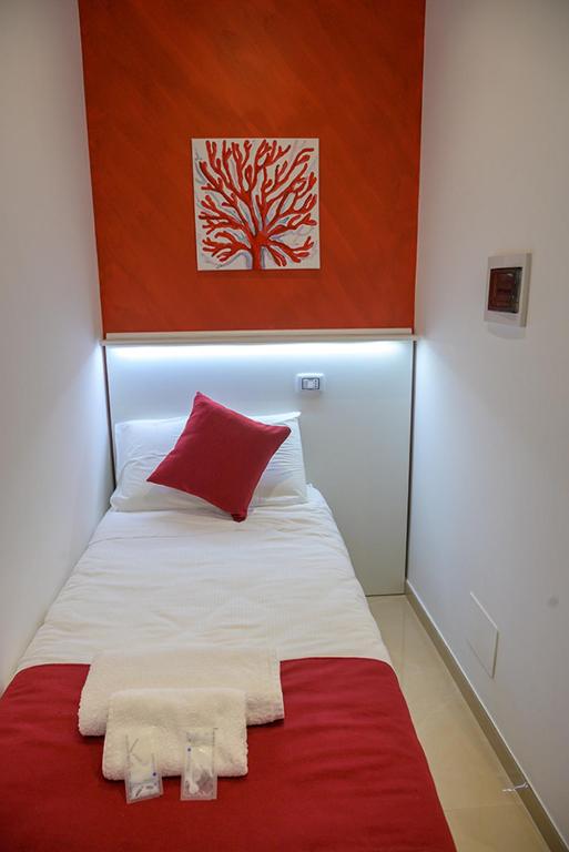 Posteľ alebo postele v izbe v ubytovaní Corallo Rosso B&B