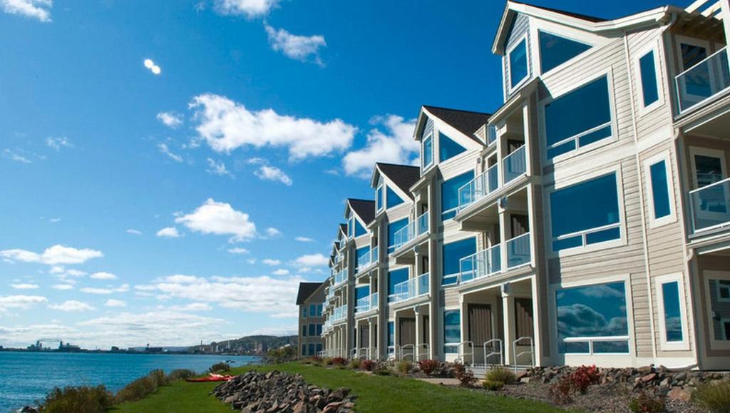 a large apartment building with a view of the water at Beacon Pointe on Lake Superior in Duluth