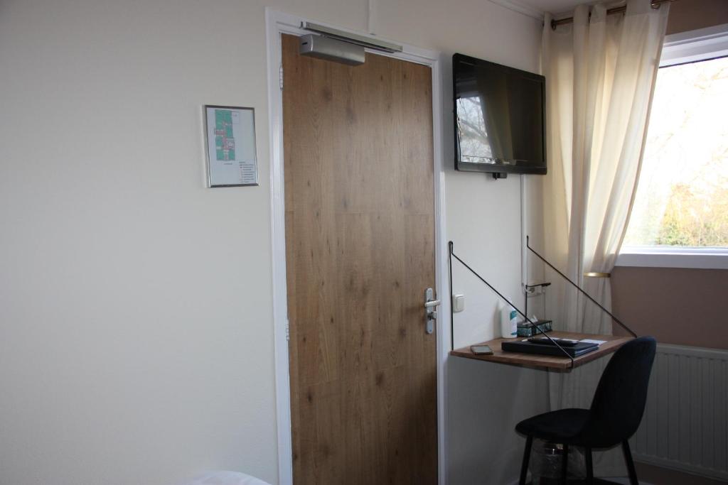 TV a/nebo společenská místnost v ubytování Maison Bellefleur B&B - Pension