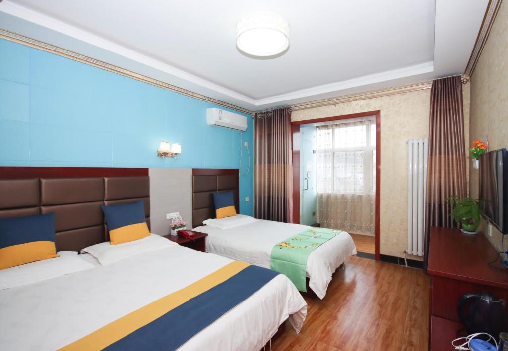 Postel nebo postele na pokoji v ubytování One Meter Sunshine Xi'an Xianyang International Airport Hotel