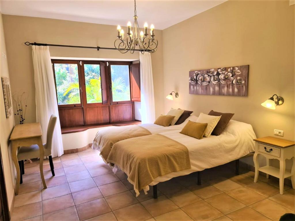Postel nebo postele na pokoji v ubytování Haciendita Gomera