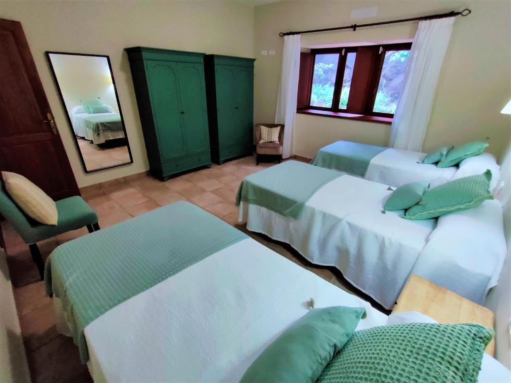 Postel nebo postele na pokoji v ubytování Haciendita Gomera