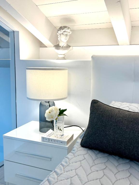 A bed or beds in a room at PAGANINI suites and apartments