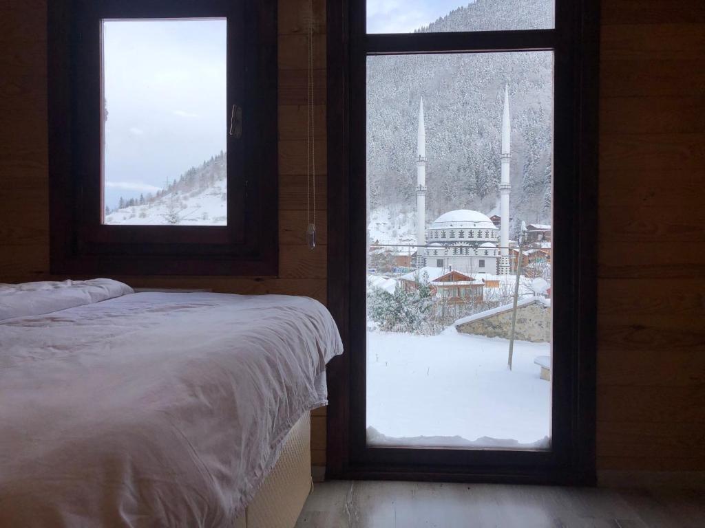 A bed or beds in a room at CERRAHPAŞA SUİTE HOTEL