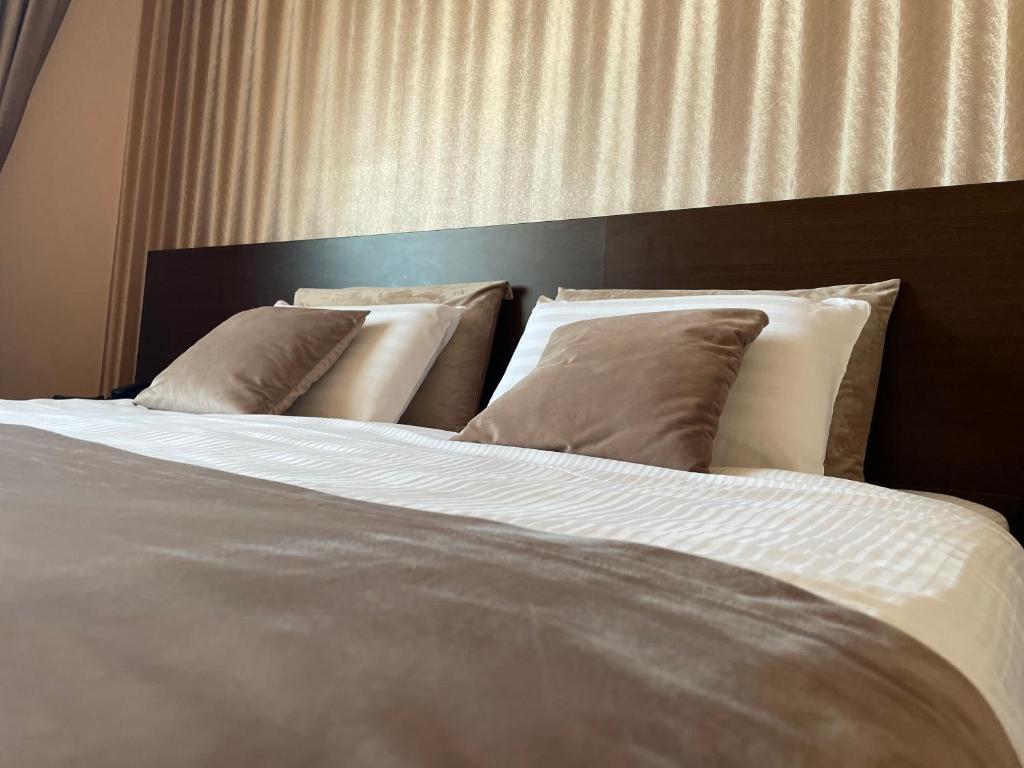 Postel nebo postele na pokoji v ubytování Hotel Athos