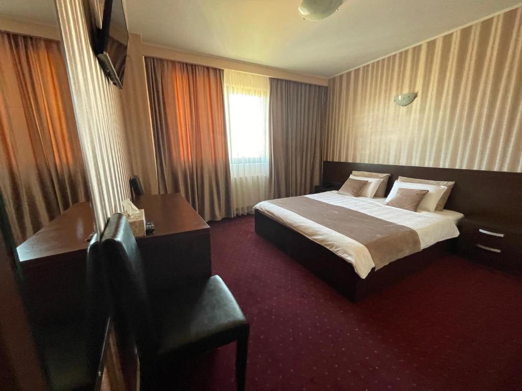 Postel nebo postele na pokoji v ubytování Hotel Athos