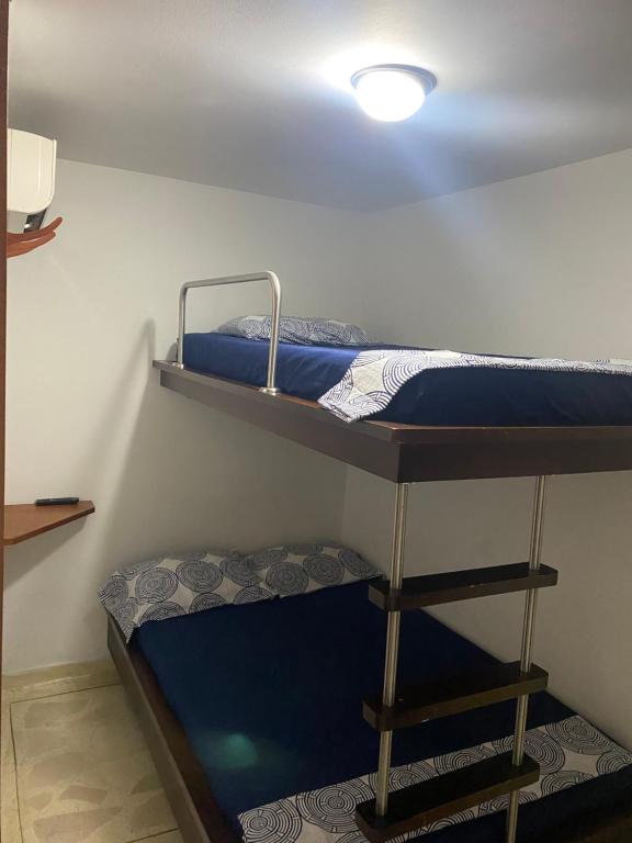 Postel nebo postele na pokoji v ubytování Hostal El Recreo