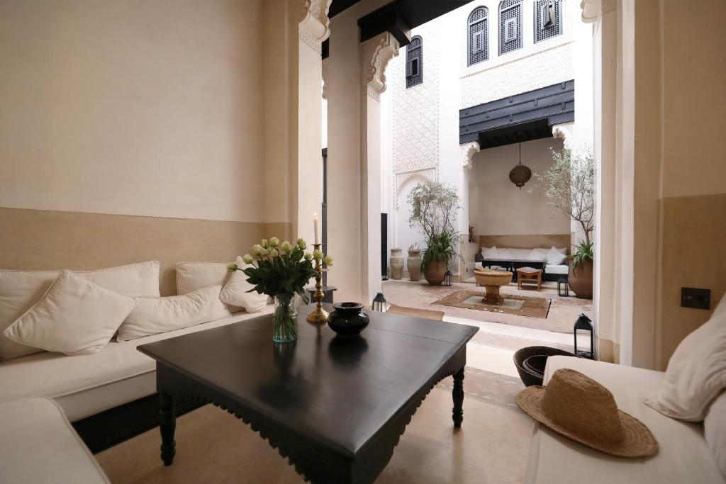 a living room with a couch and a coffee table at Riad Azzouna 13 in Marrakech