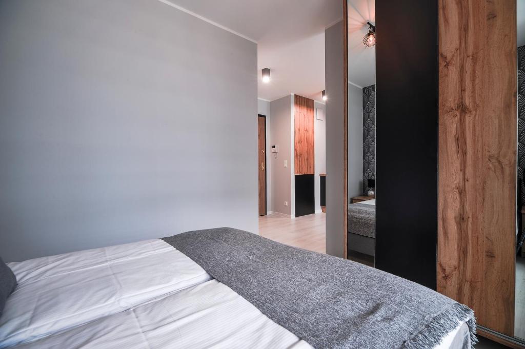 Posteľ alebo postele v izbe v ubytovaní CITYSTAY Plac Unii Gdynia Apartment