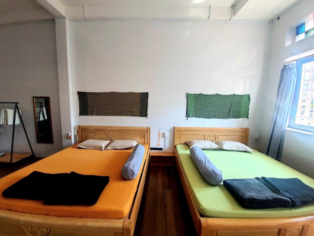 Postel nebo postele na pokoji v ubytování Homestay Khoa Chaudoc