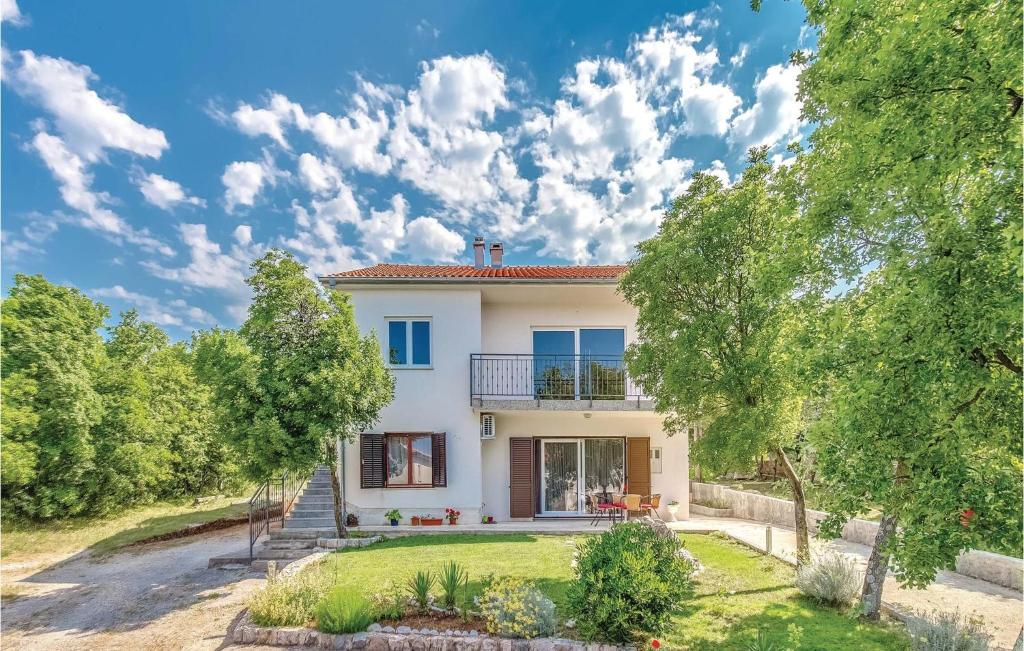 an image of a villa with a yard at Cozy Apartment In Smrika With Kitchen in Šmrika