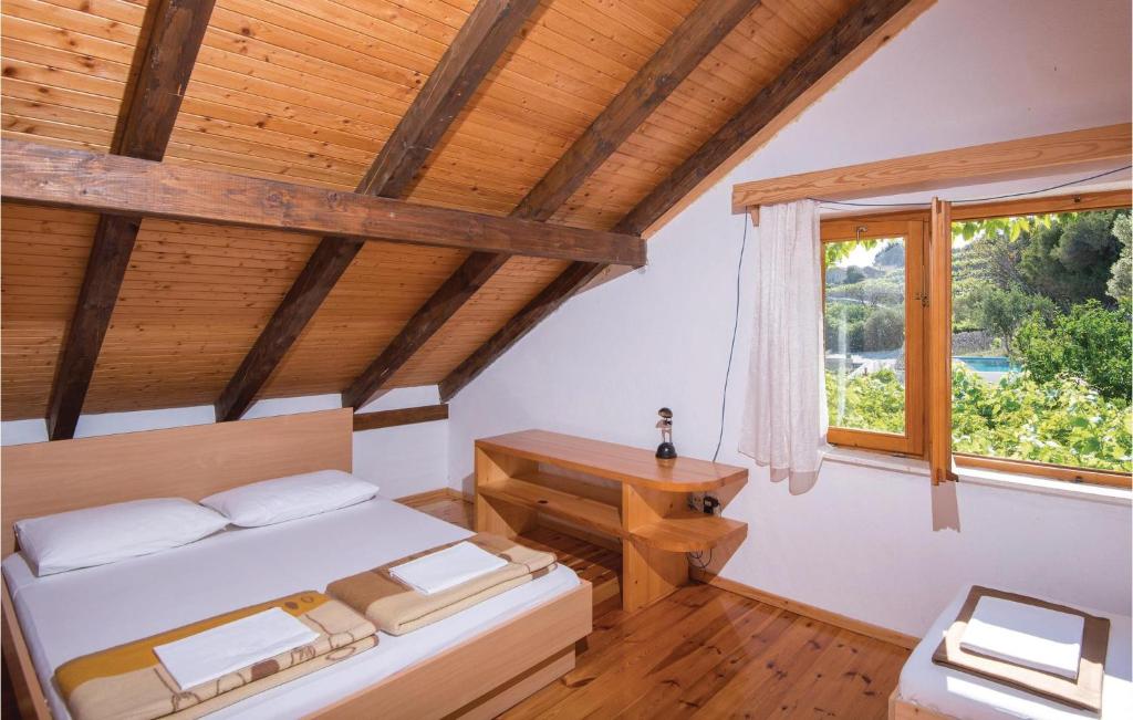 Postel nebo postele na pokoji v ubytování Holiday Home Podobuce Bb Iii