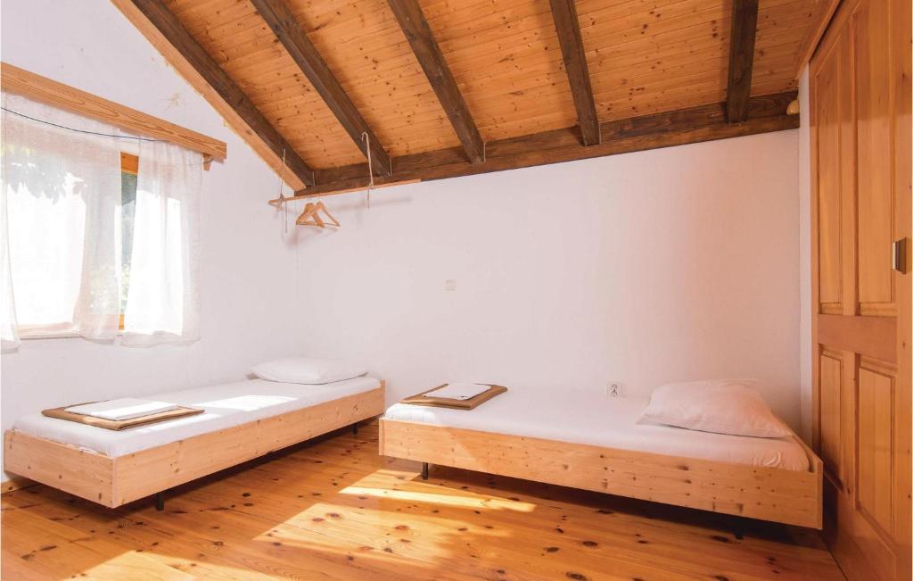 Postel nebo postele na pokoji v ubytování Holiday Home Podobuce Bb Iii