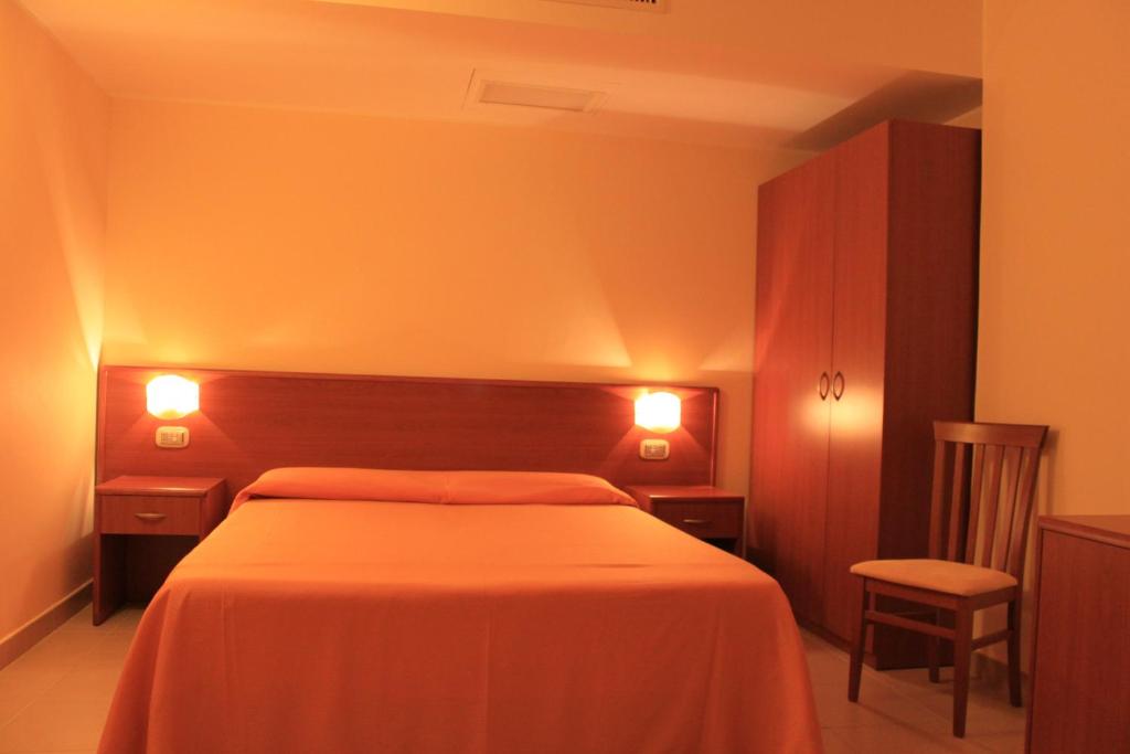 Postel nebo postele na pokoji v ubytování Hotel Sette E Mezzo