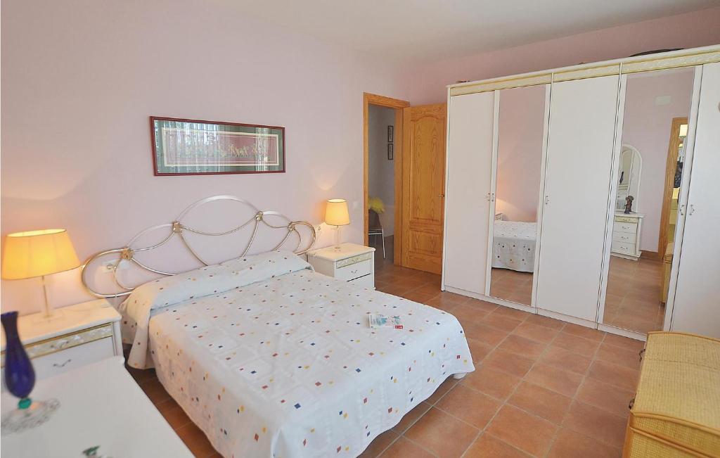 A bed or beds in a room at 7 Bedroom Lovely Home In Santa Susanna