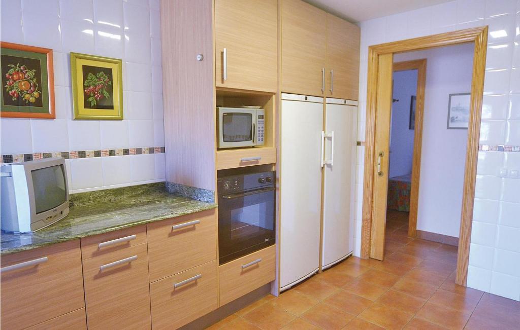 A kitchen or kitchenette at 7 Bedroom Lovely Home In Santa Susanna