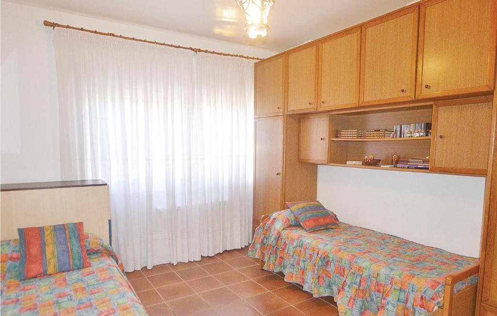 A bed or beds in a room at 7 Bedroom Lovely Home In Santa Susanna