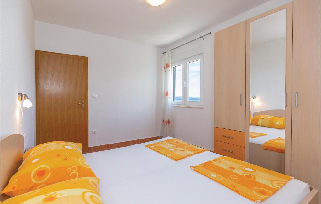 Posteľ alebo postele v izbe v ubytovaní Holiday Apartment Krvavica 07