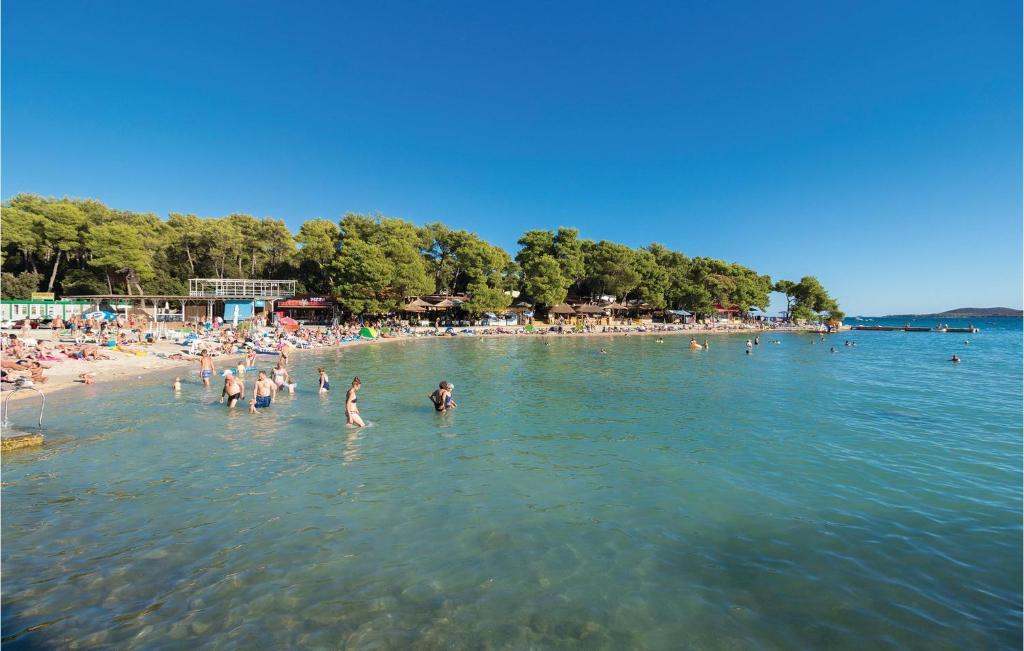 a group of people in the water at a beach at Awesome Apartment In Sv, Petar With 2 Bedrooms And Wifi in Sveti Petar