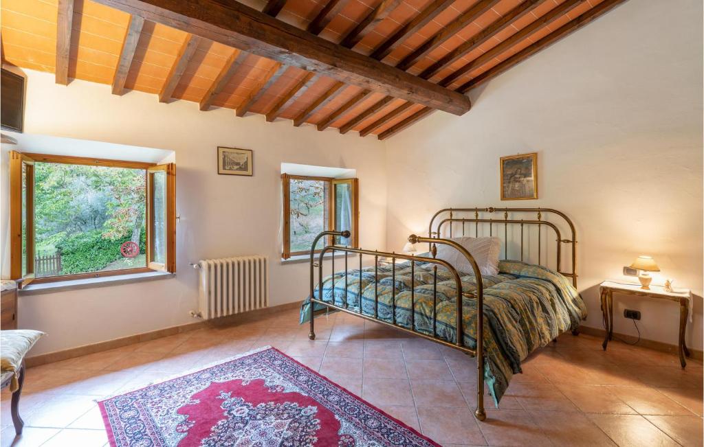A bed or beds in a room at Awesome Home In Dicomano Fi