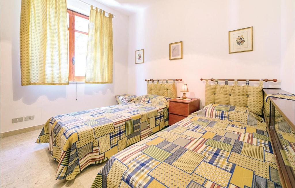 Łóżko lub łóżka w pokoju w obiekcie Villa Caterina