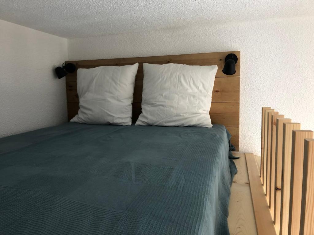 Postel nebo postele na pokoji v ubytování Appartement vue imprenable avec emplacement idéal