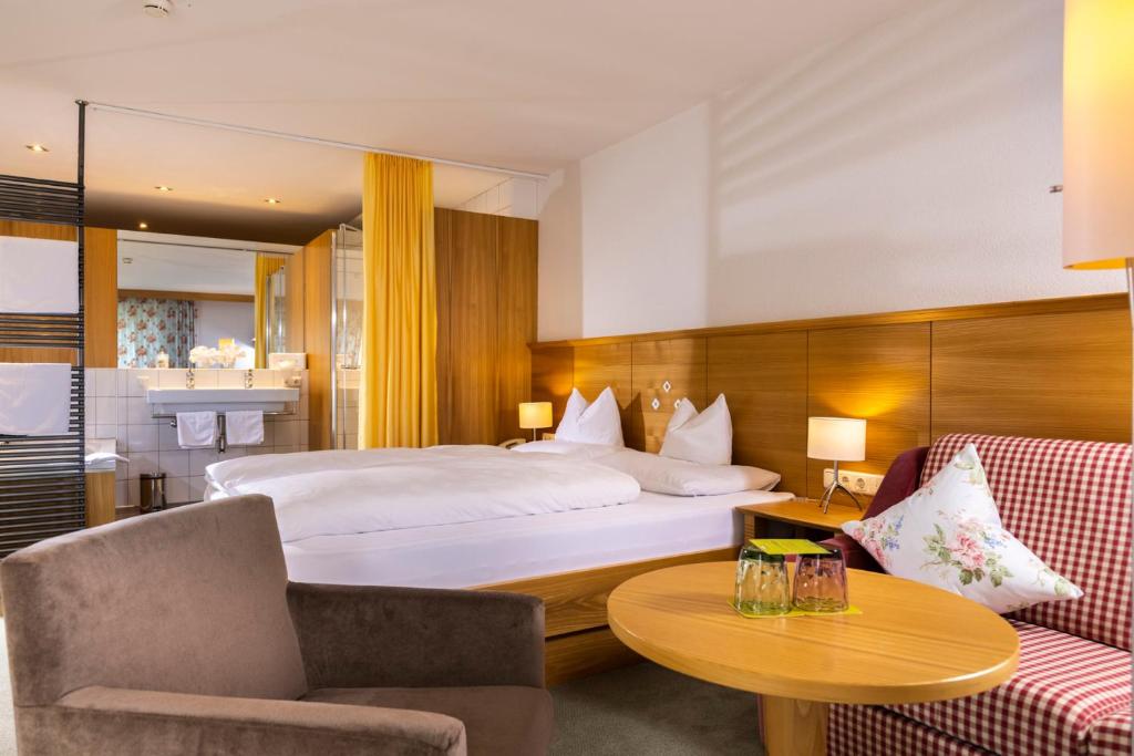 Postel nebo postele na pokoji v ubytování Hotel Walserberg