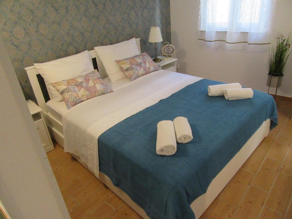 Ένα ή περισσότερα κρεβάτια σε δωμάτιο στο Apartment Lela Split II