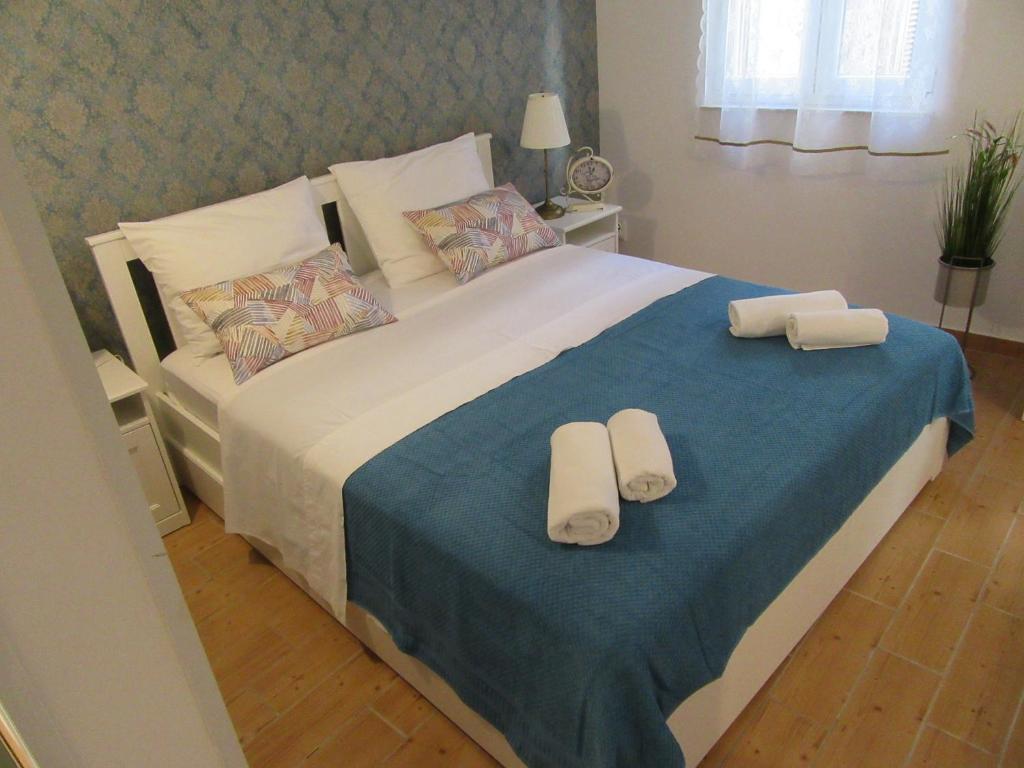 Posteľ alebo postele v izbe v ubytovaní Apartment Lela Split II