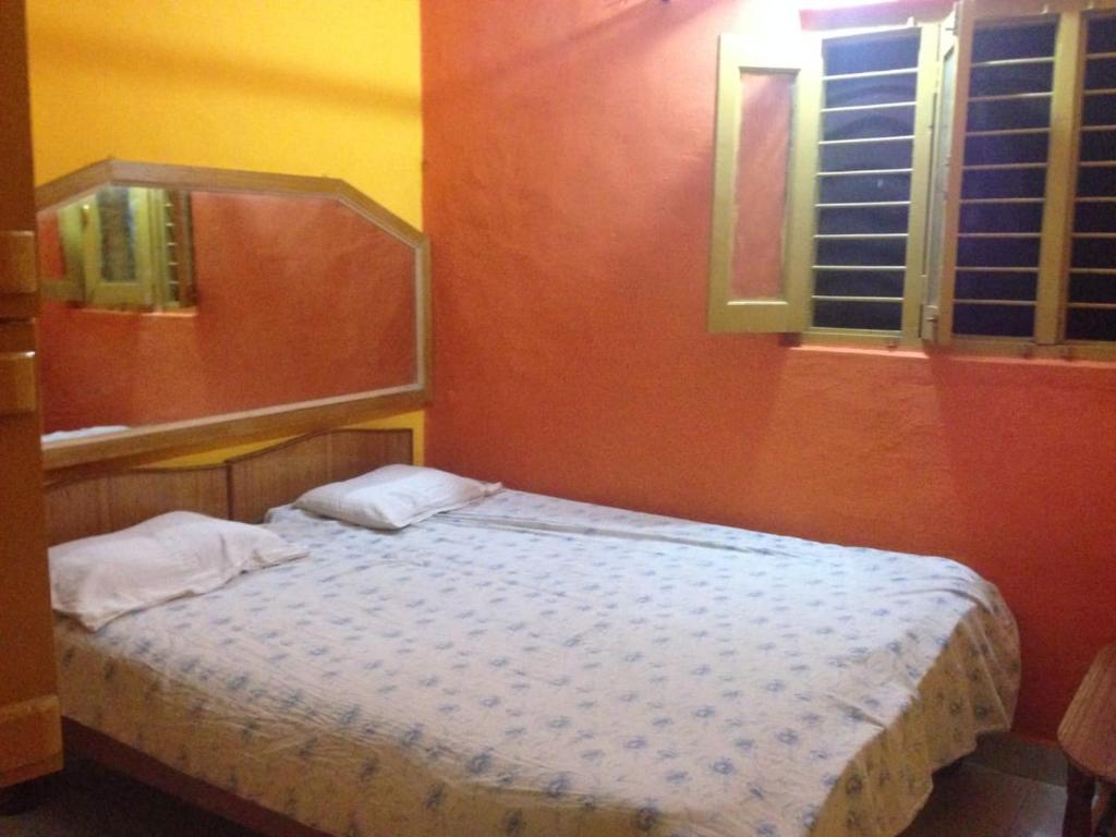 Letto o letti in una camera di Archana Guest House River View