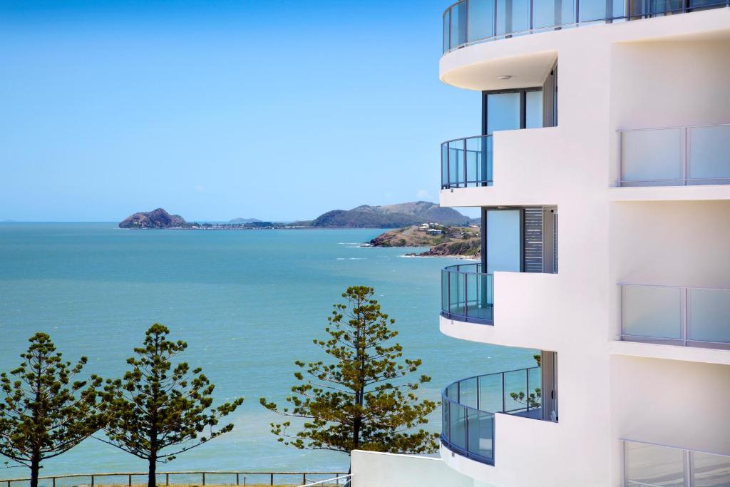 an apartment building with a view of the water at Oshen Holiday Apartments Yeppoon in Yeppoon