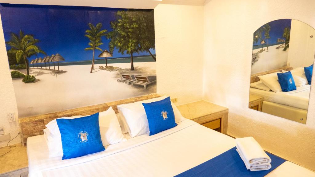 Postel nebo postele na pokoji v ubytování Clarkton Hotel Apartment