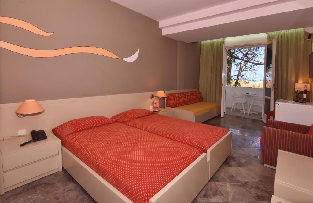 Postel nebo postele na pokoji v ubytování Mantenia Hotel