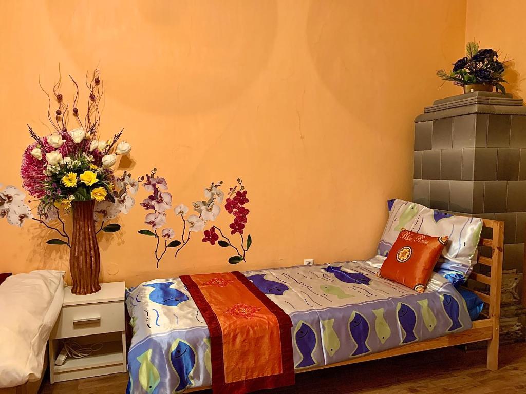 Postel nebo postele na pokoji v ubytování Blue Rose Apartman