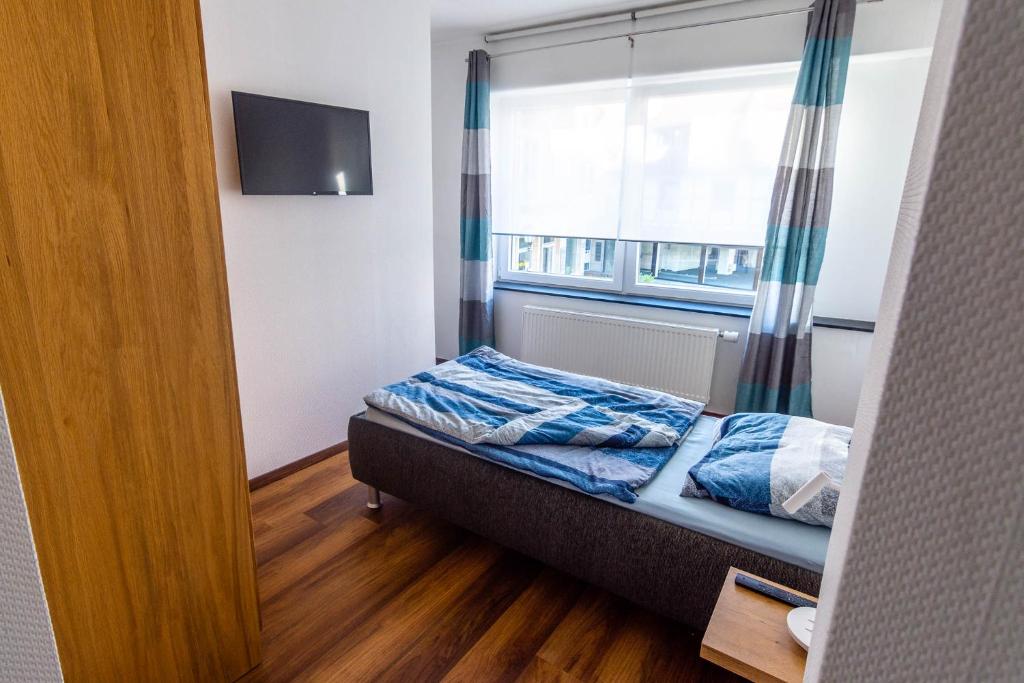 Postel nebo postele na pokoji v ubytování Gästehaus Jagsttal