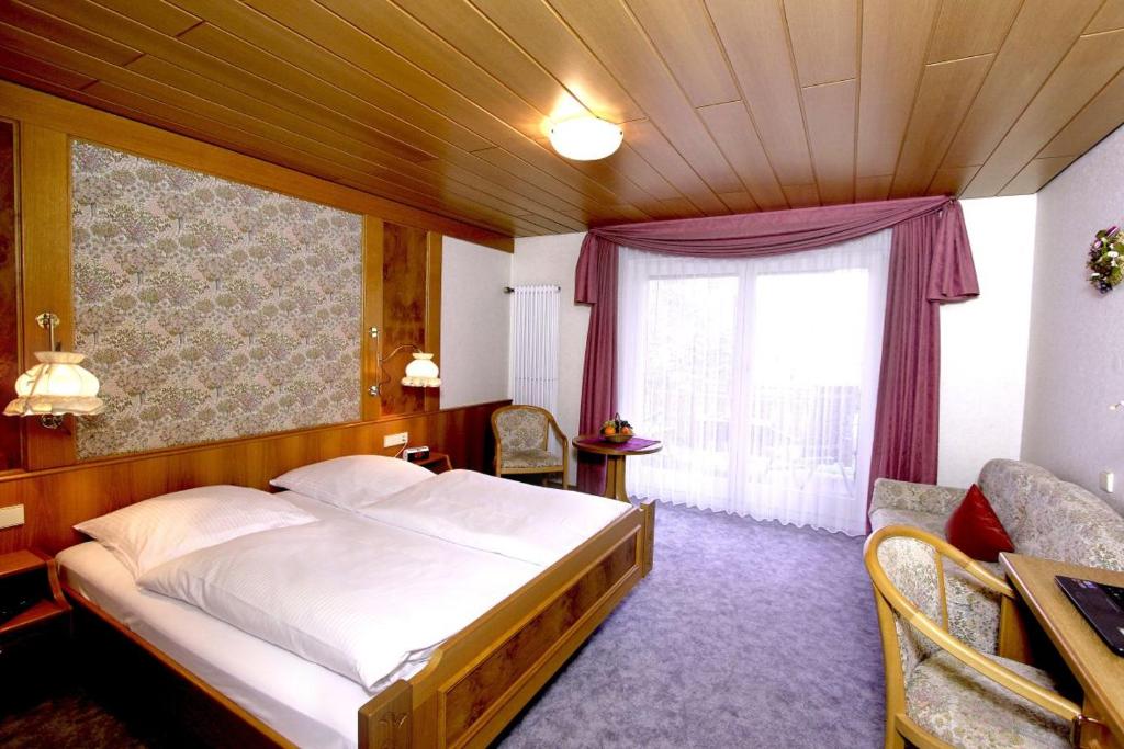 Postel nebo postele na pokoji v ubytování Gasthaus Seehof