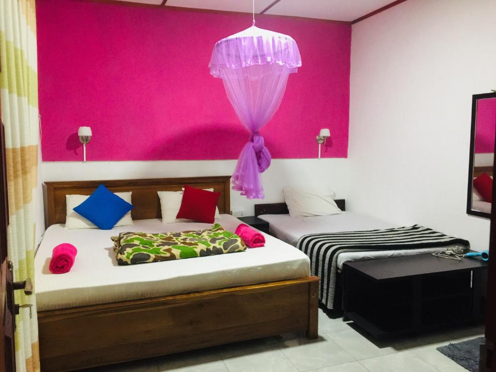 Postel nebo postele na pokoji v ubytování orchid villa