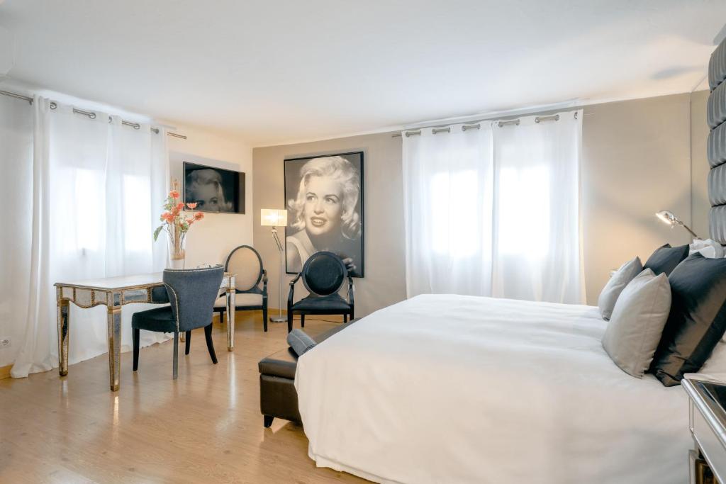 Postel nebo postele na pokoji v ubytování Hostal Parque Ibiza