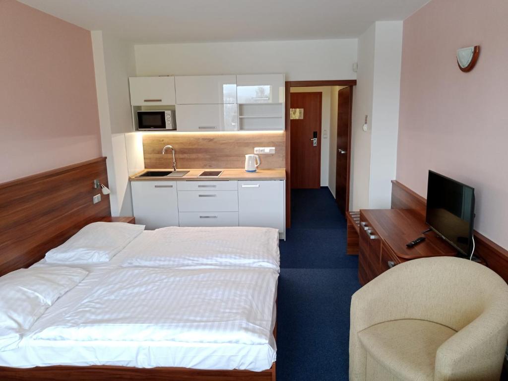 Postel nebo postele na pokoji v ubytování Apartmán Wellness hotel Frymburk