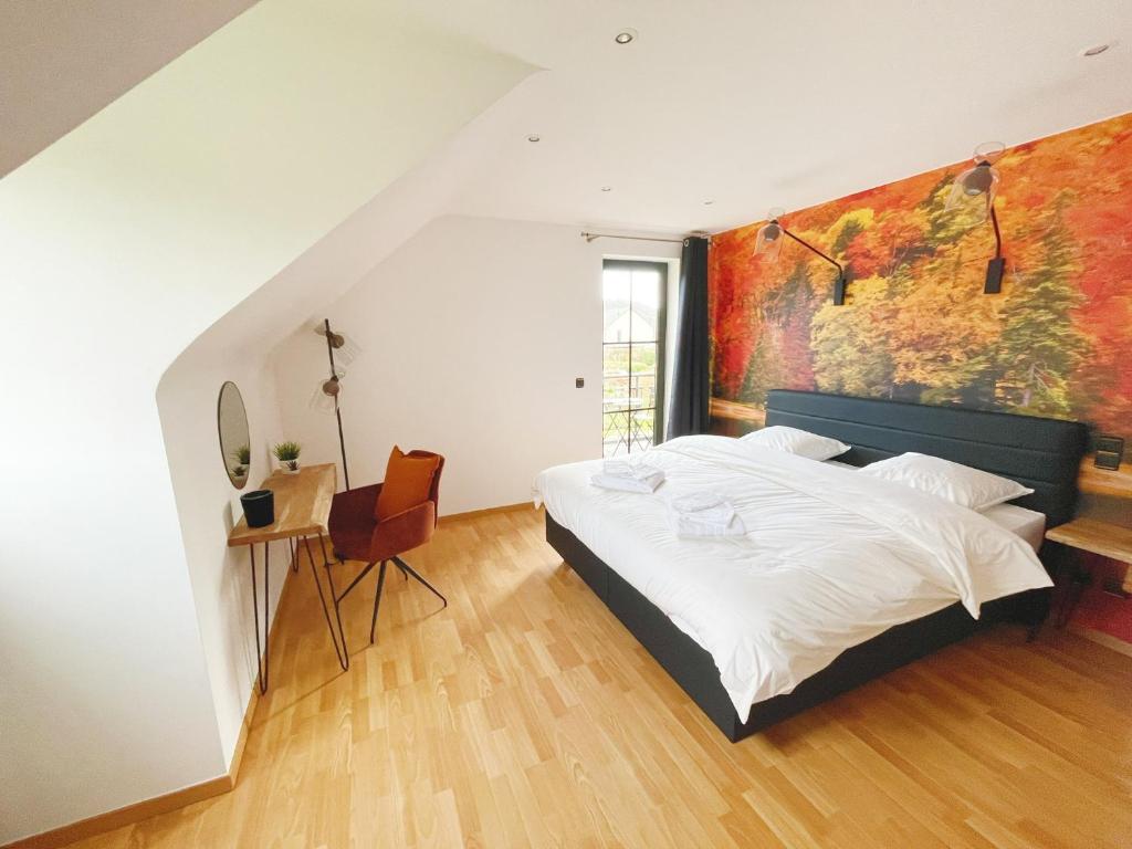 Letto o letti in una camera di Le Pact - Gîte familial