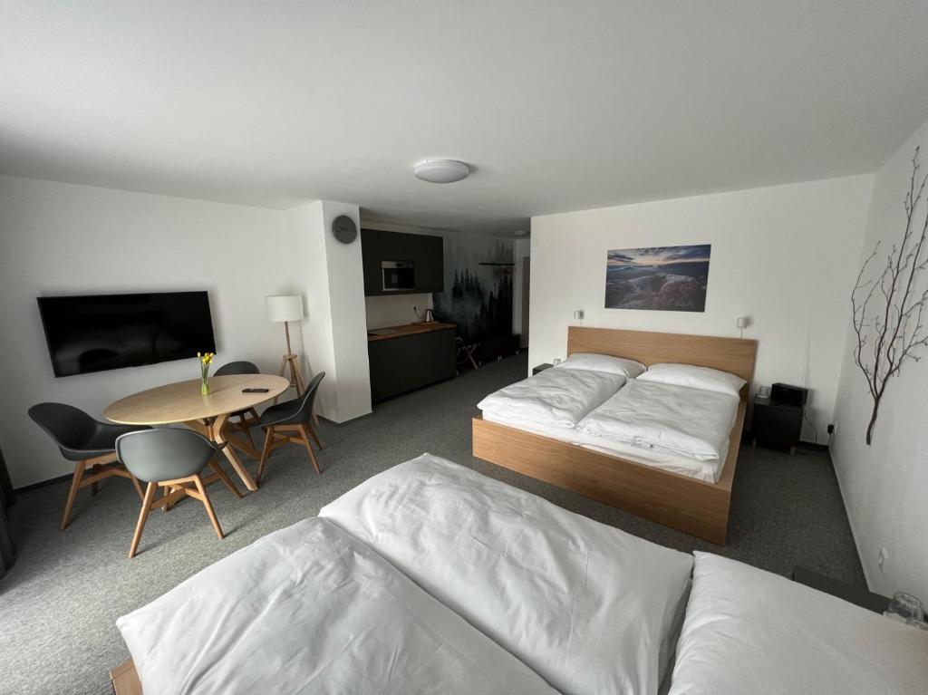 Rúm í herbergi á Hotel VARNSDORF